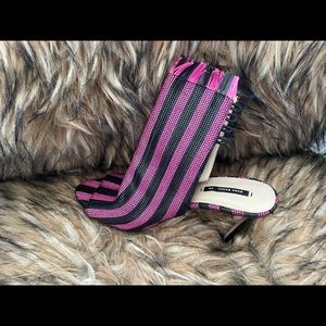 Pink and black ankle heels.